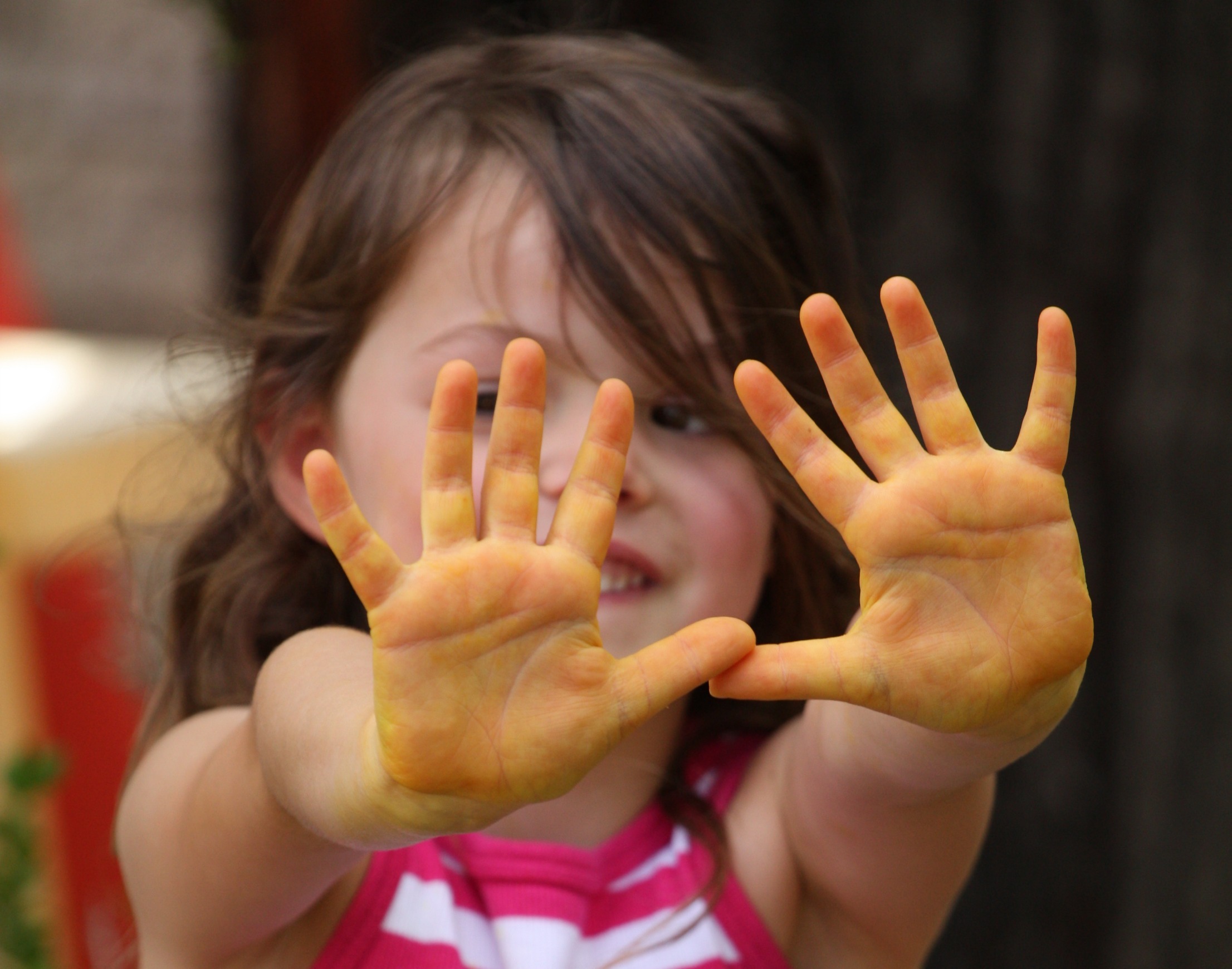 kid with painted hands